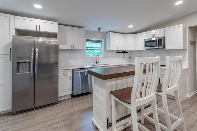 67 Gatewood Rd, Ellijay, GA 30540 - kitchen featuring appliances with stainless steel finishes, a sink, wood counters, light wood-type flooring, and recessed lighting