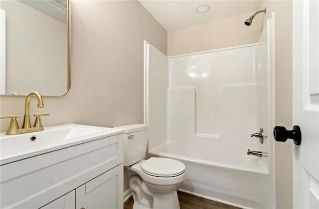 67 Gatewood Rd, Ellijay, GA 30540 - bathroom with vanity, toilet, tub / shower combination, and wood finished floors
