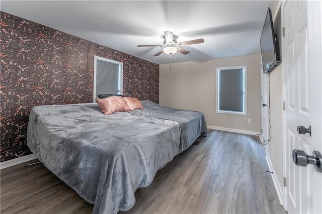 67 Gatewood Rd, Ellijay, GA 30540 - bedroom featuring wood finished floors, baseboards, wallpapered walls, and ceiling fan