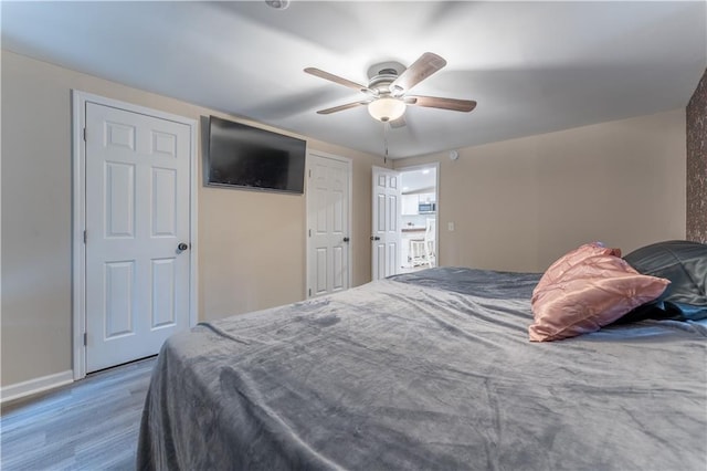 67 Gatewood Rd, Ellijay, GA 30540 - bedroom with wood finished floors, a ceiling fan, and baseboards