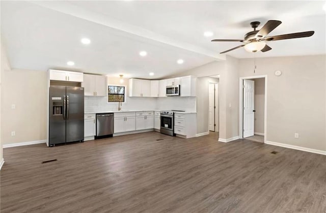 67 Gatewood Rd, Ellijay, GA 30540 - kitchen featuring appliances with stainless steel finishes, open floor plan, white cabinetry, dark wood finished floors, and baseboards