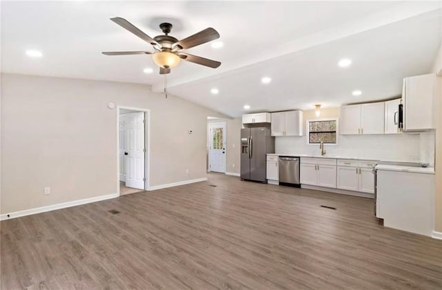67 Gatewood Rd, Ellijay, GA 30540 - kitchen featuring appliances with stainless steel finishes, a sink, wood finished floors, baseboards, and a ceiling fan