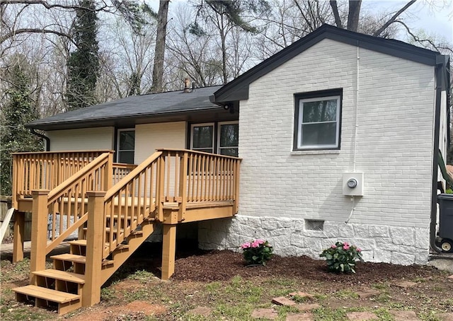 rear view of property with a deck