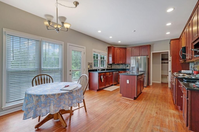 1663 Willow Way, Woodstock, GA 30188 - kitchen featuring appliances with stainless steel finishes, a sink, dark countertops, a chandelier, and recessed lighting