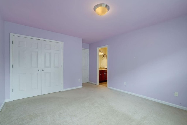 1663 Willow Way, Woodstock, GA 30188 - unfurnished bedroom with light carpet, baseboards, a closet, and ensuite bathroom