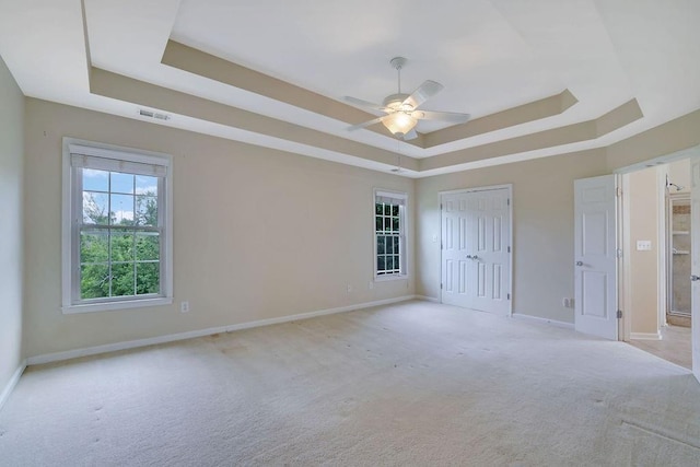 1663 Willow Way, Woodstock, GA 30188 - unfurnished bedroom featuring a tray ceiling, carpet floors, and baseboards