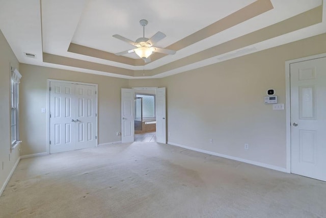 1663 Willow Way, Woodstock, GA 30188 - unfurnished bedroom featuring a raised ceiling, light colored carpet, baseboards, and a closet