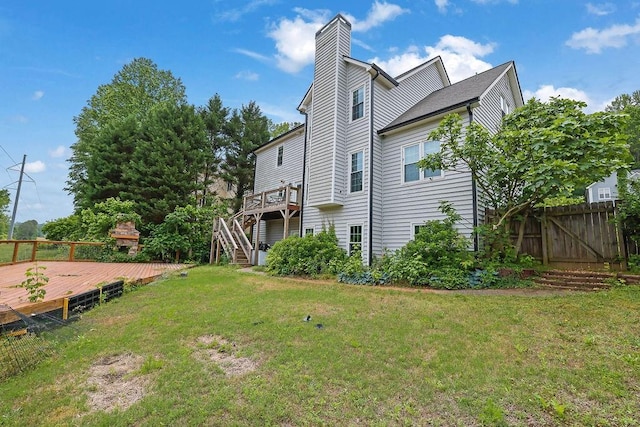 1663 Willow Way, Woodstock, GA 30188 - back of house featuring a wooden deck, a chimney, and stairs