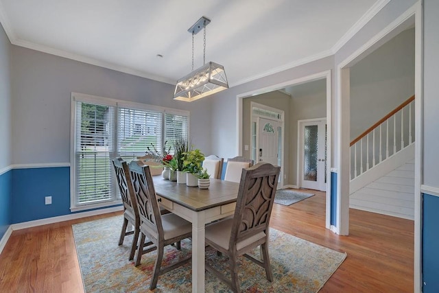 1663 Willow Way, Woodstock, GA 30188 - dining area featuring wood finished floors, crown molding, baseboards, and stairs