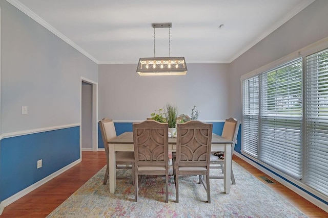 1663 Willow Way, Woodstock, GA 30188 - dining room with wood finished floors, crown molding, and baseboards