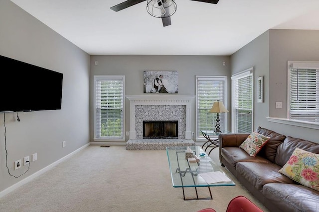 1663 Willow Way, Woodstock, GA 30188 - living area featuring ceiling fan, baseboards, a fireplace with raised hearth, and carpet floors