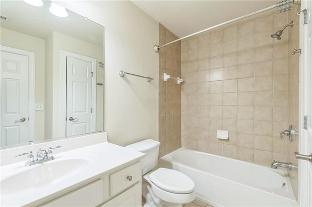 bathroom featuring toilet, vanity, and shower / washtub combination