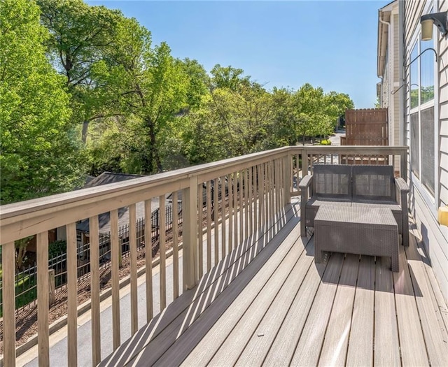 wooden terrace featuring an outdoor living space