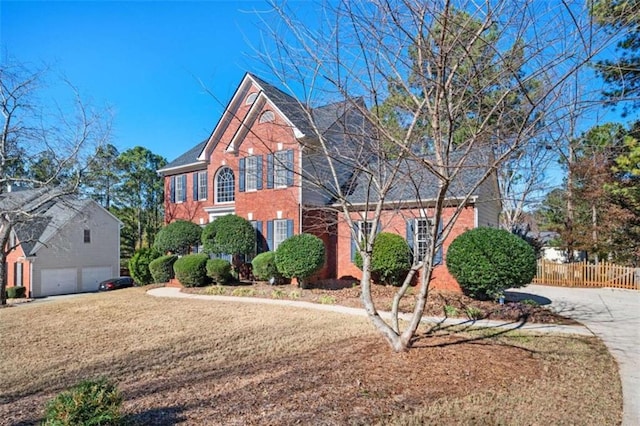 front facade with a garage and a front yard