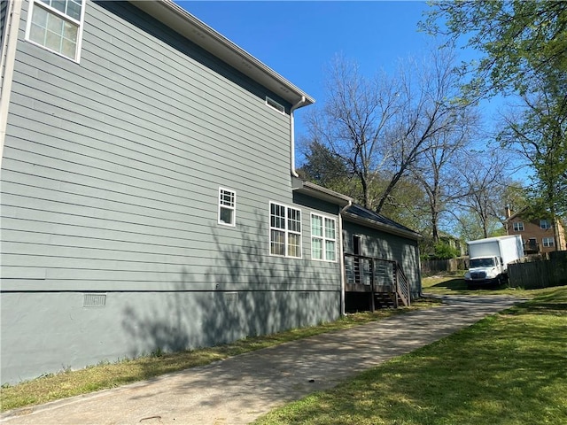 view of home's exterior with a yard