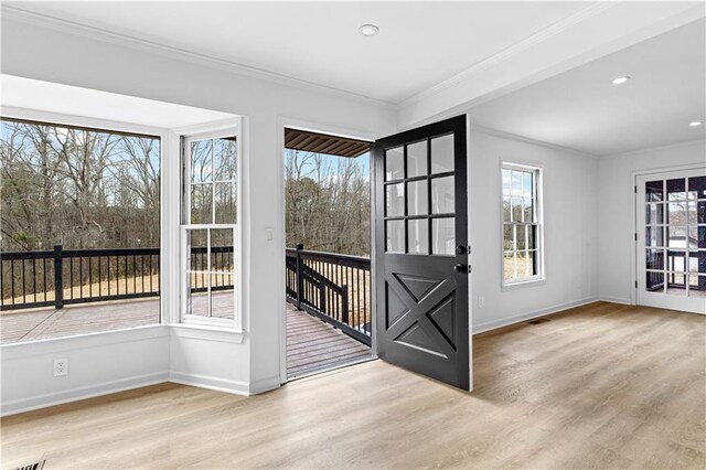 stairway with baseboards, wood finished floors, visible vents, and recessed lighting