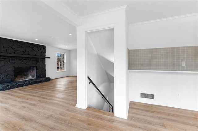 living room featuring recessed lighting, visible vents, stairway, and wood finished floors