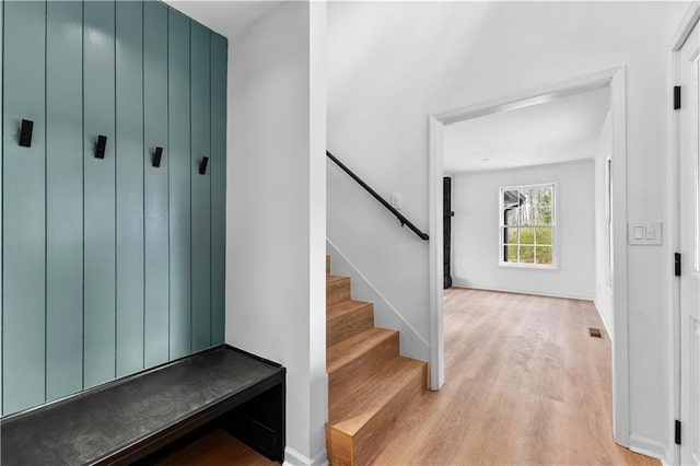 staircase featuring wood finished floors