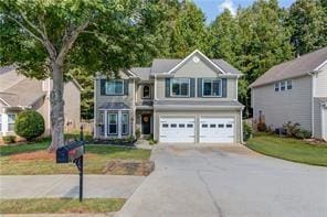 3485 Parkbrooke Ln, Duluth, GA 30096 - traditional-style home with a garage and concrete driveway