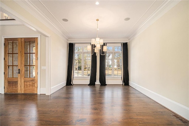 unfurnished dining area with a notable chandelier, dark wood-type flooring, crown molding, and french doors