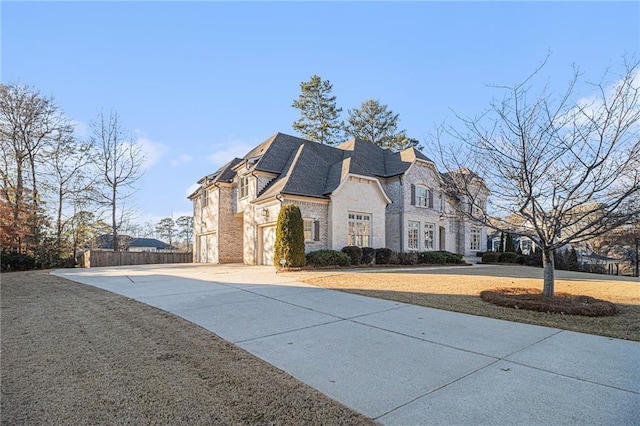 view of front of property with a garage and a front yard