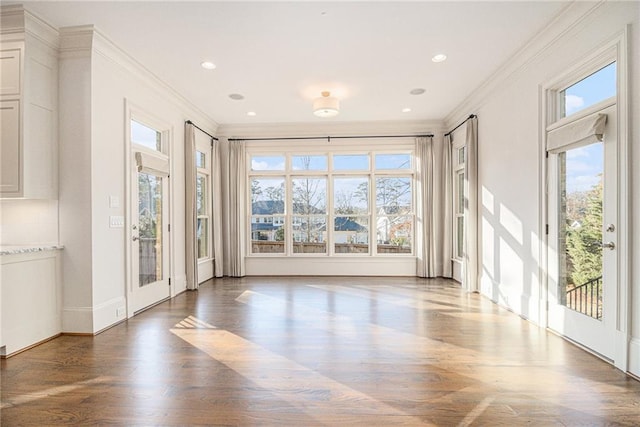 empty room featuring crown molding and dark hardwood / wood-style floors