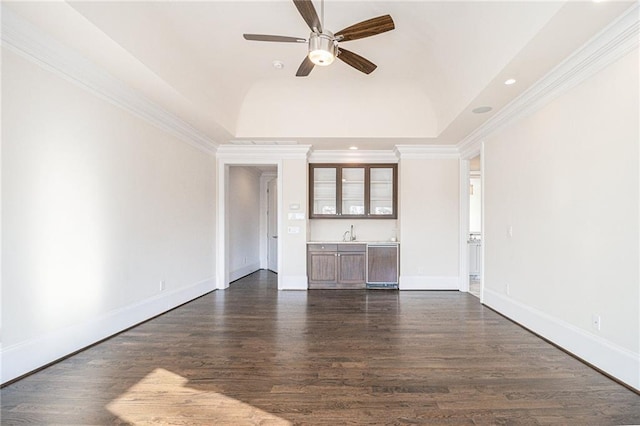 unfurnished living room featuring ornamental molding, ceiling fan, dark wood-type flooring, sink, and lofted ceiling