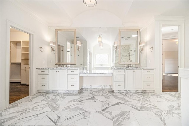 bathroom with a bathtub, vanity, and vaulted ceiling