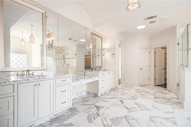 bathroom featuring vanity, an enclosed shower, and lofted ceiling