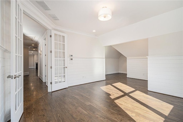 bonus room featuring french doors and dark hardwood / wood-style floors