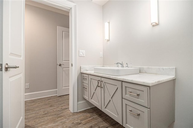 bathroom with vanity and wood-type flooring