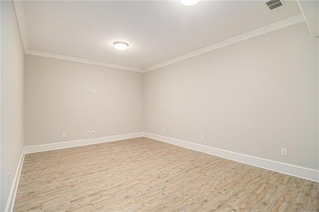 unfurnished room featuring light hardwood / wood-style floors and ornamental molding