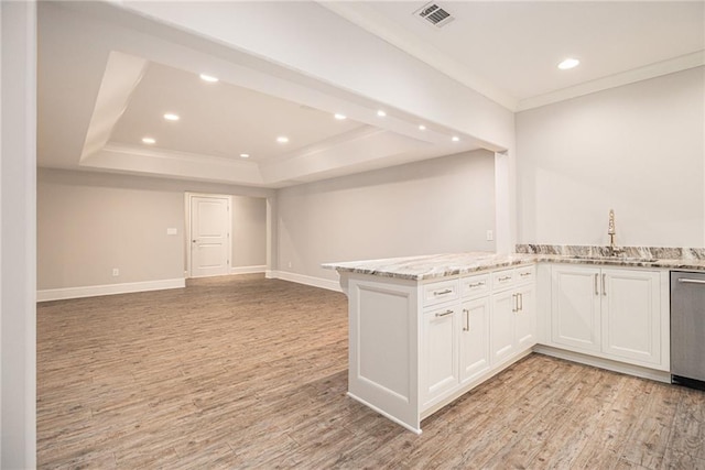 kitchen with light stone countertops, light wood-type flooring, sink, dishwasher, and white cabinetry