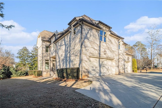 view of side of home with a garage