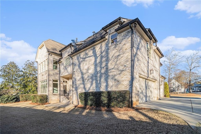 view of side of home with a garage