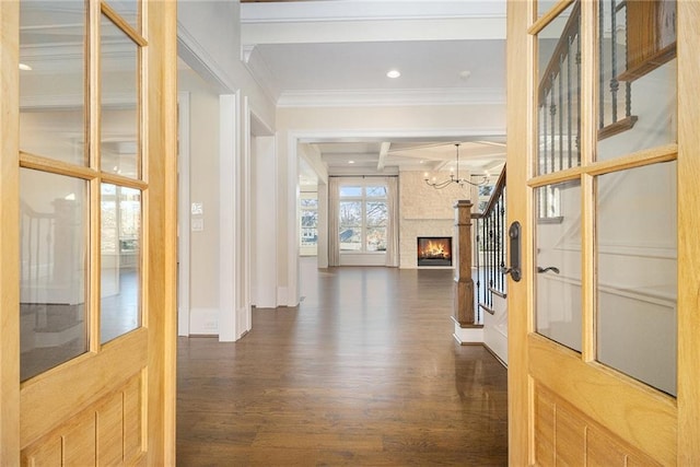 hallway featuring coffered ceiling, crown molding, beam ceiling, a chandelier, and dark hardwood / wood-style floors