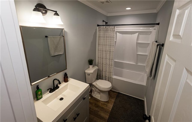 bathroom featuring visible vents, crown molding, wood finished floors, vanity, and toilet