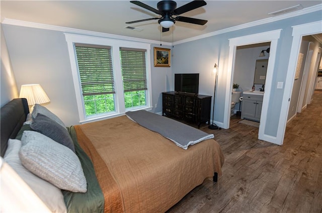 bedroom with visible vents, ornamental molding, baseboards, dark wood-style floors, and a ceiling fan