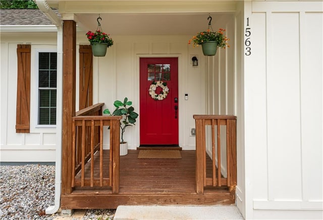 doorway to property featuring board and batten siding