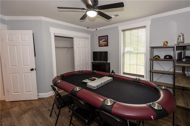 rec room featuring crown molding, ceiling fan, visible vents, and wood finished floors