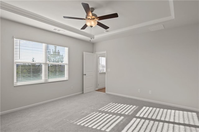 488 Village Ln, Fairburn, GA 30213 - carpeted empty room featuring a tray ceiling, ceiling fan, and baseboards