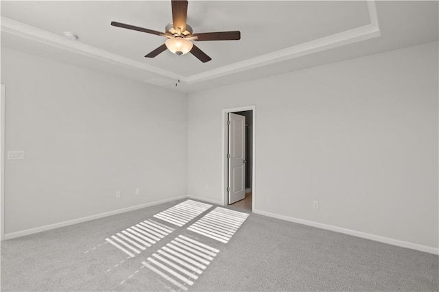 488 Village Ln, Fairburn, GA 30213 - carpeted empty room with a raised ceiling, baseboards, ceiling fan, and a smoke detector