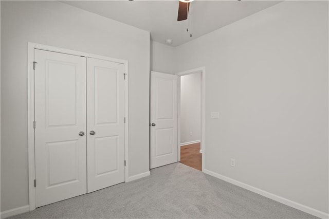 488 Village Ln, Fairburn, GA 30213 - unfurnished bedroom featuring carpet flooring, baseboards, a closet, and ceiling fan
