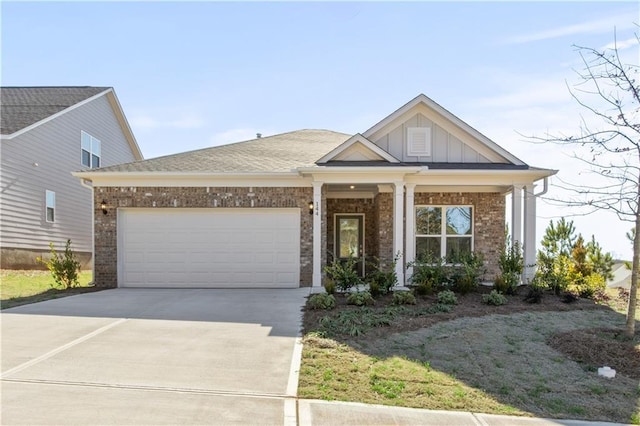 488 Village Ln, Fairburn, GA 30213 - view of front of house featuring brick siding, concrete driveway, an attached garage, and board and batten siding