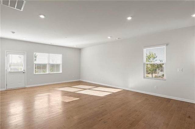488 Village Ln, Fairburn, GA 30213 - unfurnished room with healthy amount of natural light, baseboards, wood finished floors, and recessed lighting