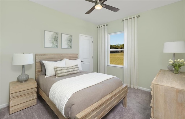 carpeted bedroom with baseboards and ceiling fan