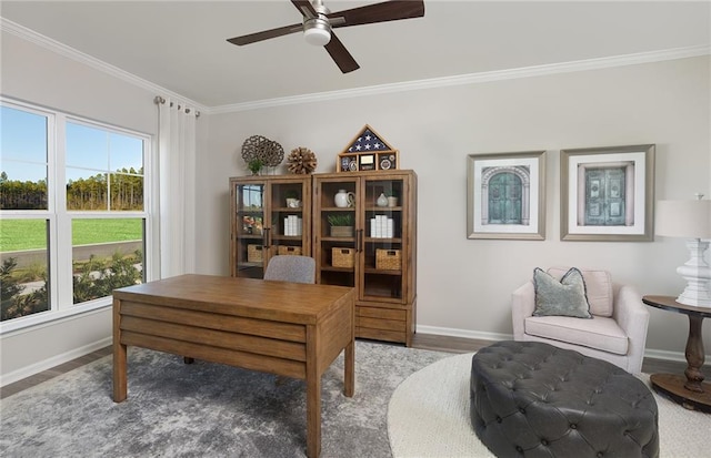 office featuring a ceiling fan, baseboards, ornamental molding, and wood finished floors