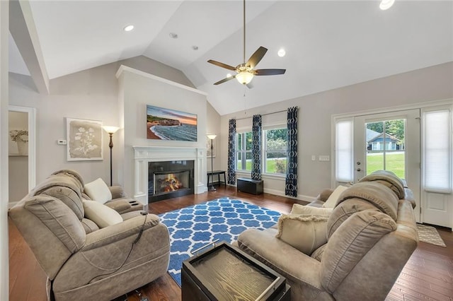 living room featuring dark wood-type flooring, ceiling fan, and high vaulted ceiling