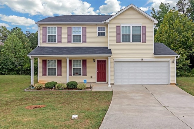 view of front of house with a garage and a front lawn