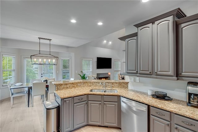 kitchen featuring dishwasher, a sink, recessed lighting, and gray cabinets